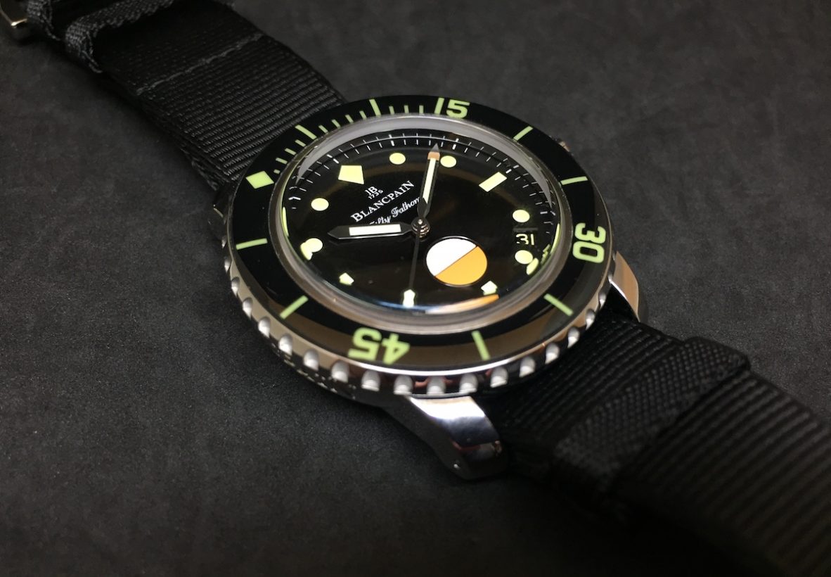 寶舶致敬五十噚MIL-SPEC腕錶特別版，不鏽鋼錶殼，錶徑40.3毫米，時、分、秒、日期、濕度計，Calibre 1155自動上鍊機芯，預估拍賣價：瑞士法郎10,000-17,000(美金11,000-18,000)。